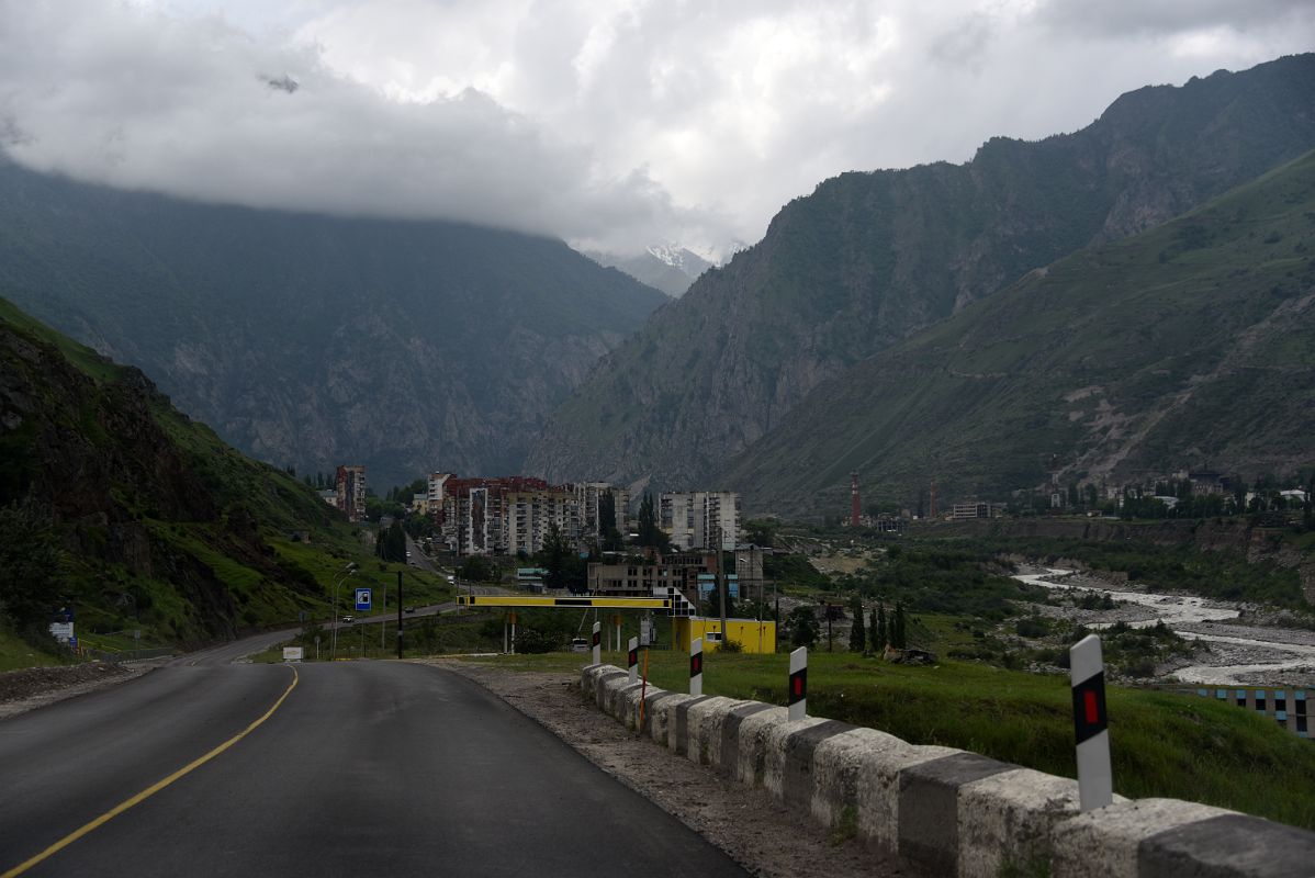 03F Driving Through A High Rise Village Hemmed In by Hills On The Way To Terskol And The Mount Elbrus Climb